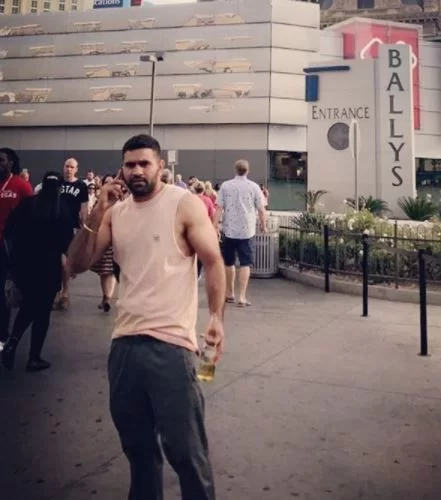 Tushar Kumar with the alcohol bottle