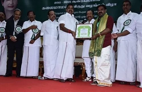 Velmurugan Receiving an Award
