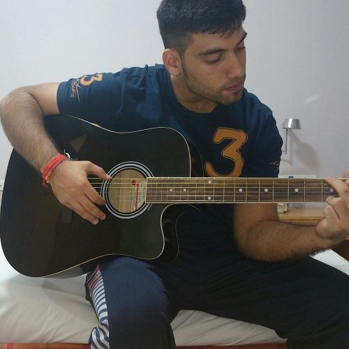 Milind Chandwani Playing the Guitar
