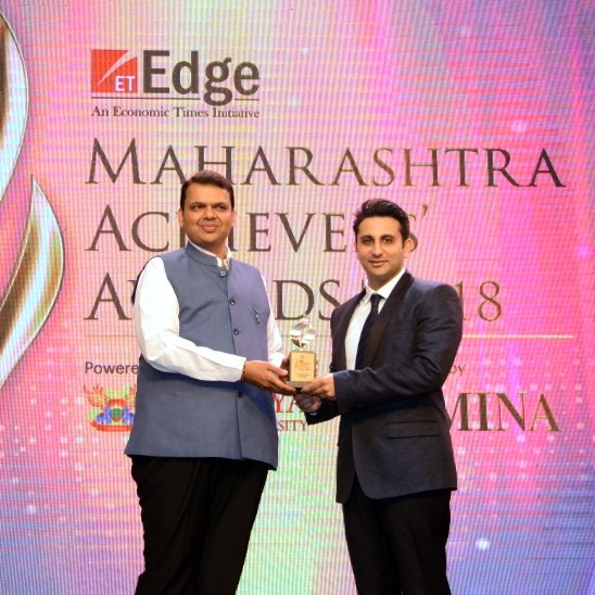 Adar Poonawalla receiving Business Leader of the year award from the then Maharashtra, CM Devendra Fadnavis