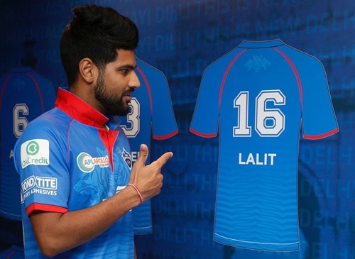 Lalit Yadav posing next to his Delhi Capitals jersey