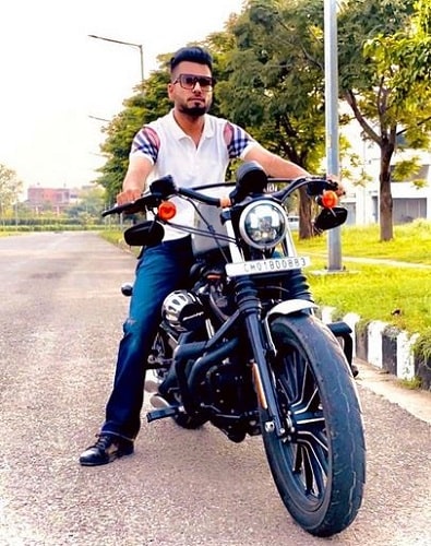 DJ Flow posing on his motorcycle