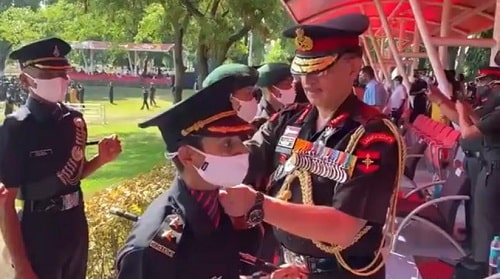 Lt Gen Y K Joshi putting the rank badges on Nitika Kaul's shoulder