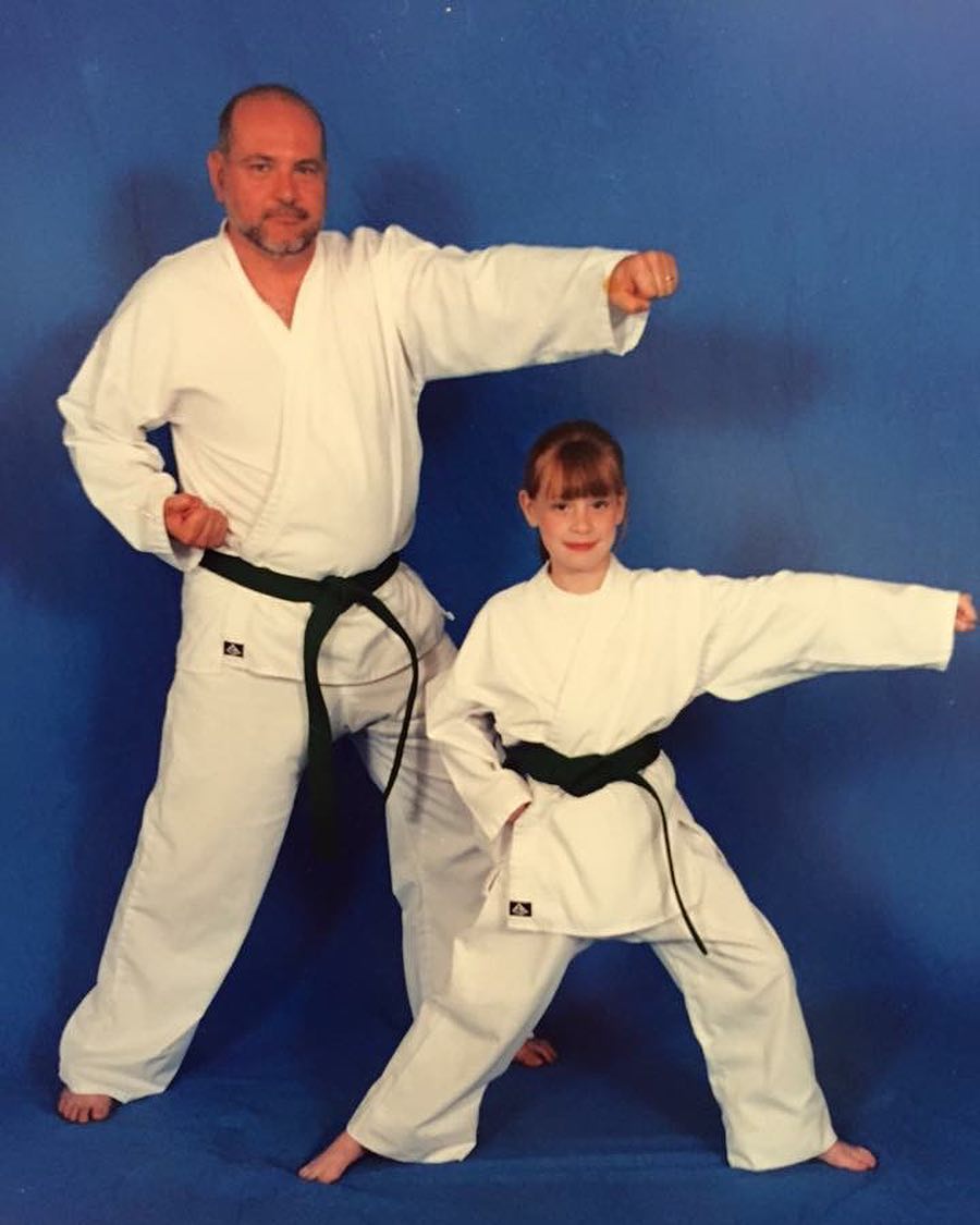 A childhood picture of Hayley while practicing Taekwondo with her father