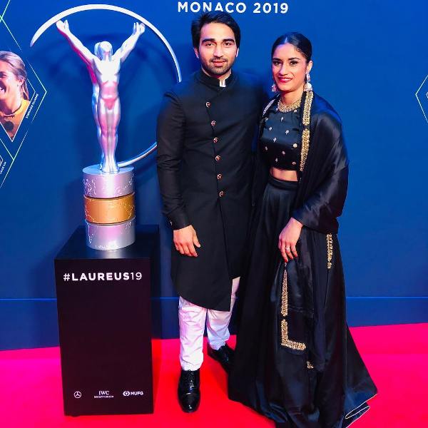 Vinesh Phogat with her husband while posing at the Laureus World Sports Awards in 2019